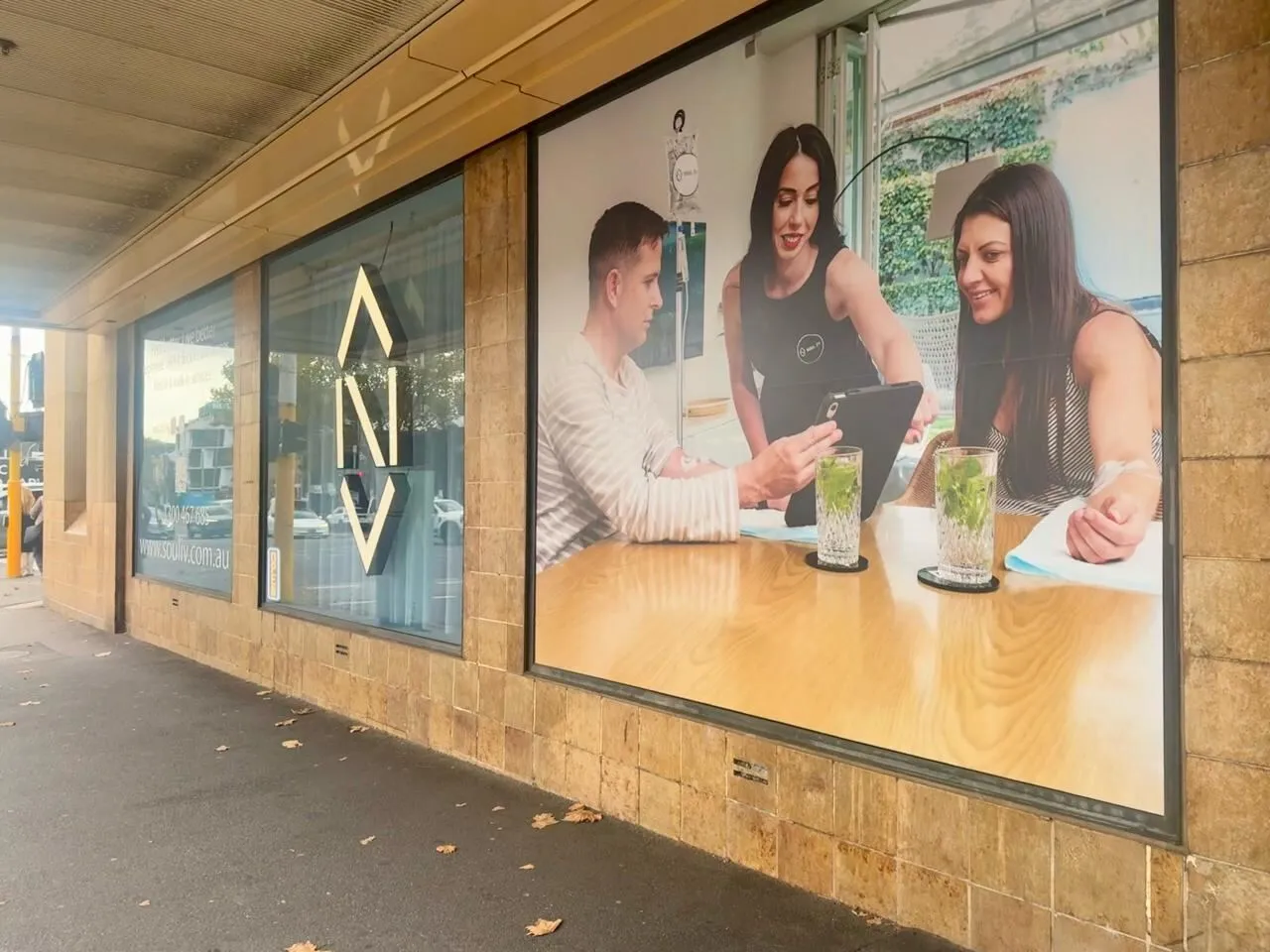 SOUL IV Melbourne CBD clinic exterior on Spencer Street, with branded window displays and heritage tile base